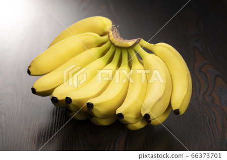 Fresh bunch of bananas black background Fresh bunch of bananas black background 66373701