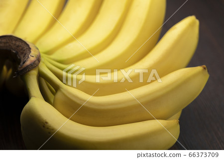 Fresh bunch of bananas black background 66373709