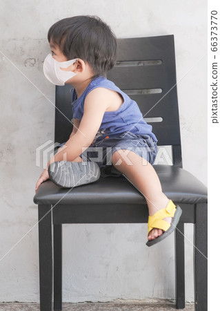 Little boy wear white mask protect Pm2.5 amd covid 66373770