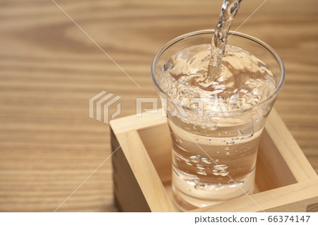 A spill of sake (mokkiri) A spill of sake (mokkiri) 66374147