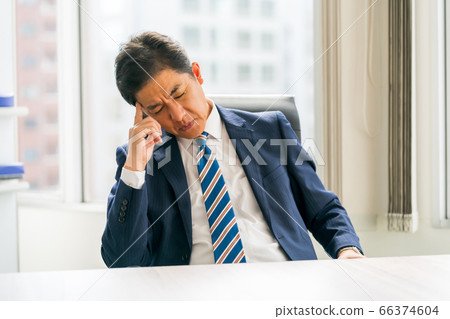 50s businessman quenching anger 66374604