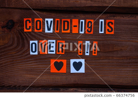 COVID-19 is over paper letters sign on wooden COVID-19 is over paper letters sign on wooden 66374756