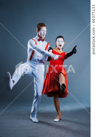 two funny mimes isolated on gray background 66375133