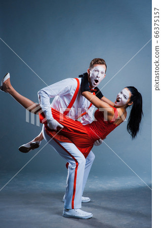 two funny mimes isolated on gray background two funny mimes isolated on gray background 66375157