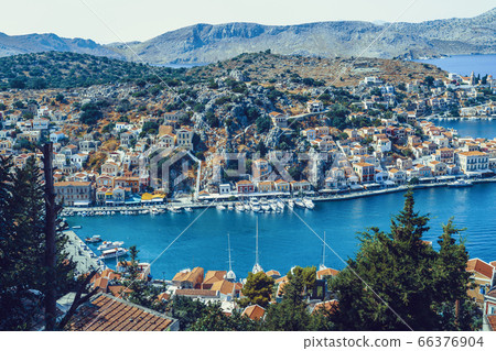 Panoramic view of the picturesque village on the Greek island of Symi, Dodecanese, Greece Panoramic view of the picturesque village on the Greek island of Symi, Dodecanese, Greece 66376904