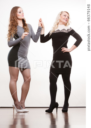 Elegant mother and daughter posing Elegant mother and daughter posing 66379148