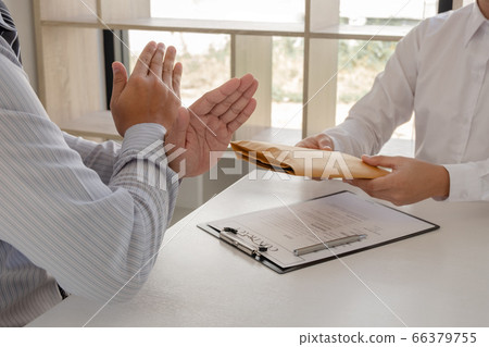 The businessman denies the money in envelope proposed by his partner to bribe the concept of bribery and corruption 66379755
