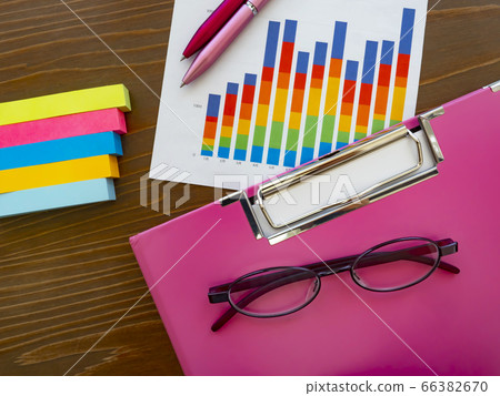 Business image · graph · binder · glasses · female 66382670