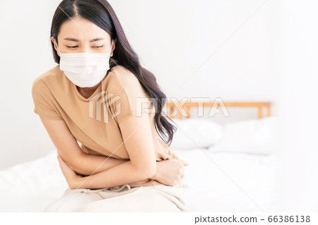 Young woman ill sick spoiled bed bedroom person material Young woman ill sick spoiled bed bedroom person material 66386138