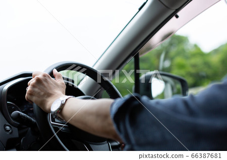 Man driving Man driving 66387681