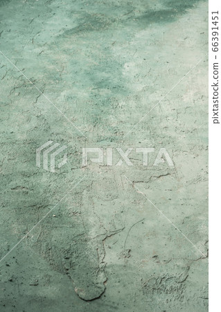 grungy stucco wall background painted with green grungy stucco wall background painted with green 66391451