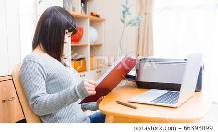 Woman confirming documents Procedure copy space 16:9 Woman confirming documents Procedure copy space 16:9 66393099