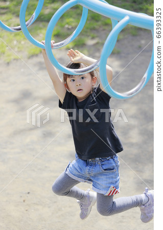 Infant (5-year-old) playing on a cloud ladder Infant (5-year-old) playing on a cloud ladder 66393325