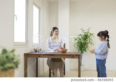 Child carrying food to mother Child carrying food to mother 66398093