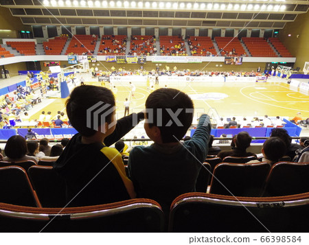 Two boys watching a Kagawa Five Arrows basketball game Two boys watching a Kagawa Five Arrows basketball game 66398584