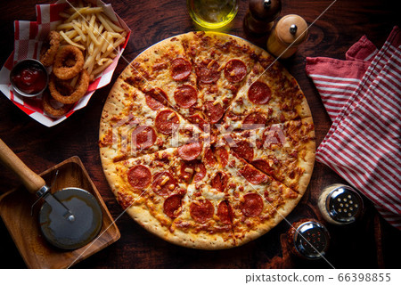 pepperoni pizza with french fries and onion rings 66398855