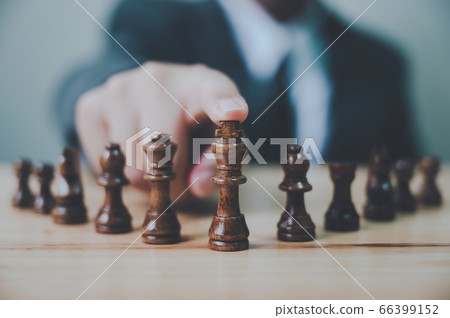 Businessman with chess board game 66399152