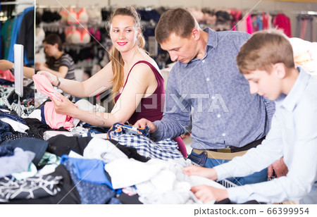 Couple with their son in an underwear store 66399954