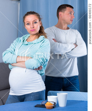 Husband and pregnant wife arguing at home Husband and pregnant wife arguing at home 66400172