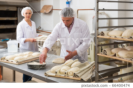 Portrait of experienced professional baker... - Stock Photo