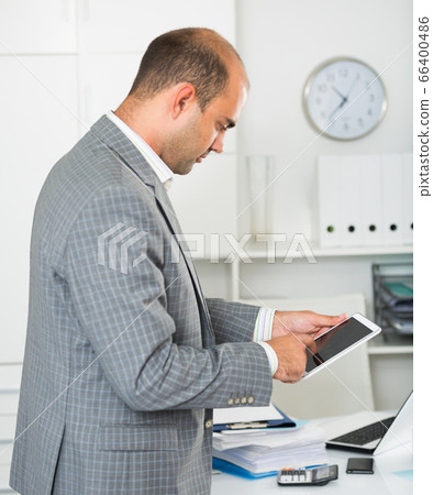 Businessman working and touching screen Businessman working and touching screen 66400486