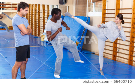 People fighting with coach at gym 66400710