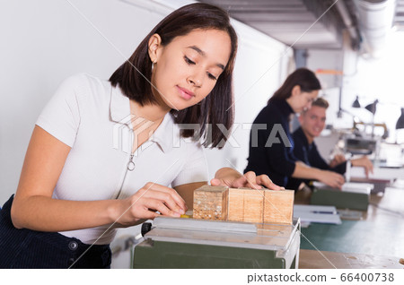 Girl working on architectural model 66400738