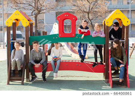 Children of different ages play on the playground 66400861