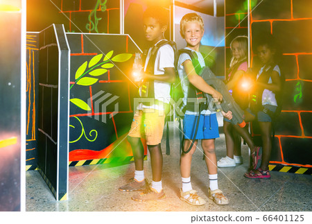 Preteen boys posing with laser guns 66401125