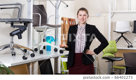 Salesgirl inviting to visit chair salon Salesgirl inviting to visit chair salon 66401273