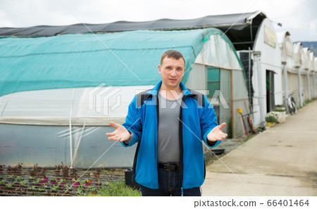 Farmer welcoming to greenhouse Farmer welcoming to greenhouse 66401464