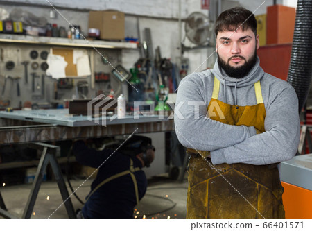 Proffessional young man engineer posing during work 66401571