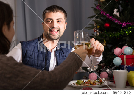 Couple having christmas dinner and watching tv Couple having christmas dinner and watching tv 66401830