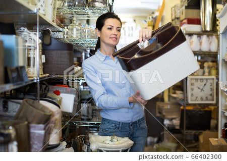 Nice woman choosing purpose basket 66402300