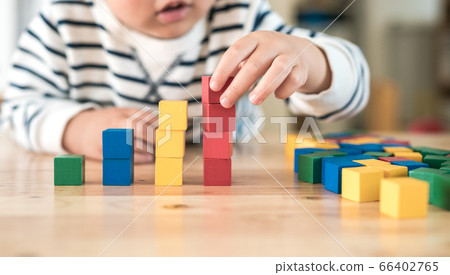 Children playing with blocks 66402765