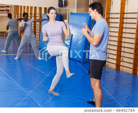 People Practicing Self Defense Techniques Stock Photo