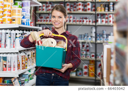 female is standing with instruments for repair 66403042