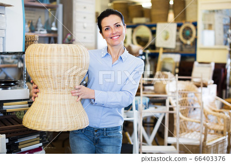 woman purcaser choosing straw stool woman purcaser choosing straw stool 66403376