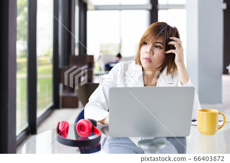 asian successful female working with laptop at home. concept woman alternative work freelance. 66403872
