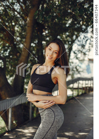Cute girl have a rest in a summer park Cute girl have a rest in a summer park 66407344