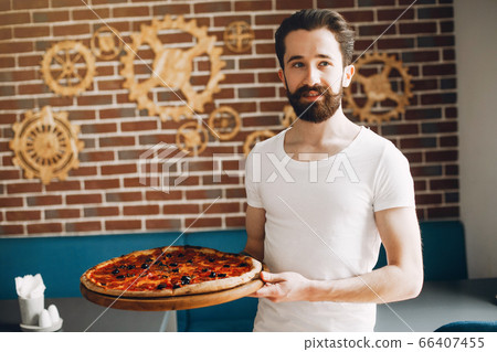 Chef in the kitchen prepares pizza Chef in the kitchen prepares pizza 66407455