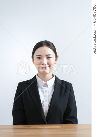 Young woman in a suit looking at camera 66408700