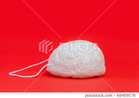 Natural Konjac Cleansing Sponge for face and body care on orange Natural Konjac Cleansing Sponge for face and body care on orange 66409576