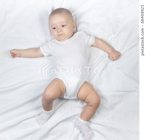 Photo of seven-month-old baby on a white background 66409925