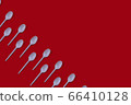 Plastic spoons on dark burgundy background pattern 66410128