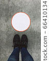 Top view of female legs in sneakers 66410134
