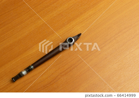 Special mouthpiece pipe for tobacco smoking. Nicotine use. Copy space. 66414999