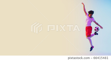 Football or soccer player on gradient background in neon light - motion, action, activity concept Football or soccer player on gradient background in neon light - motion, action, activity concept 66415481