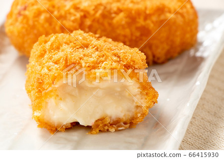 Cross section of a bale-shaped cream croquette. Cross section of a bale-shaped cream croquette. 66415930