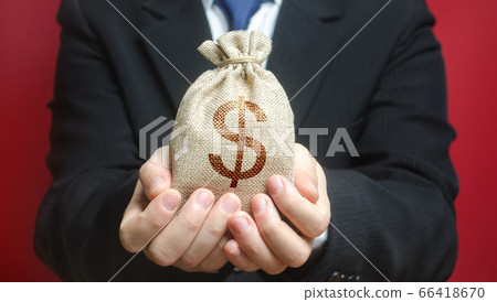 A man holds out a bag of money. Provision of money on credit,\
grant. Project financing. Payment purchases, profits dividends.\
Business investment. Bank deposit. Donations. Financial social\
assistance